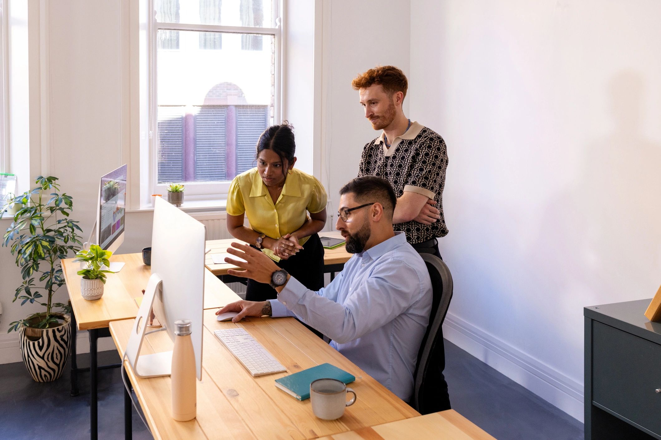 Startup team reviewing digital business strategy in an office