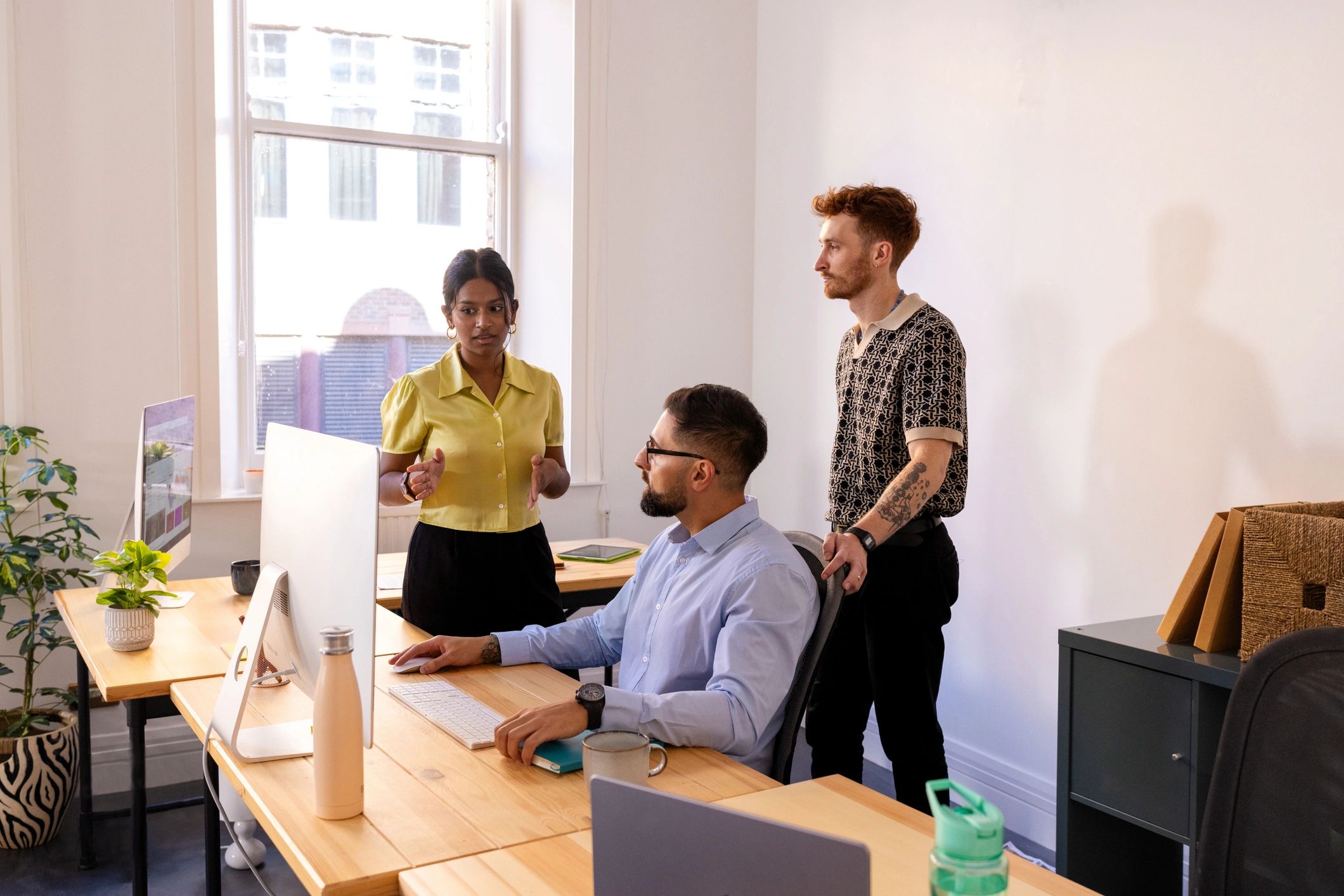 Team discussing work in a modern office